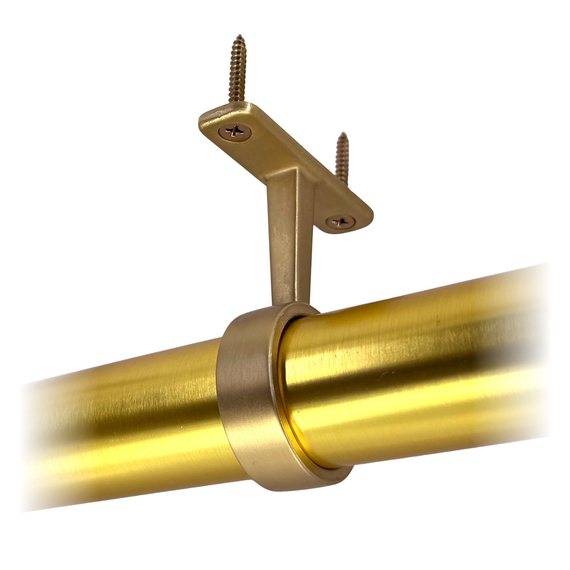 satin brass round closet rod mid support hanger in use
